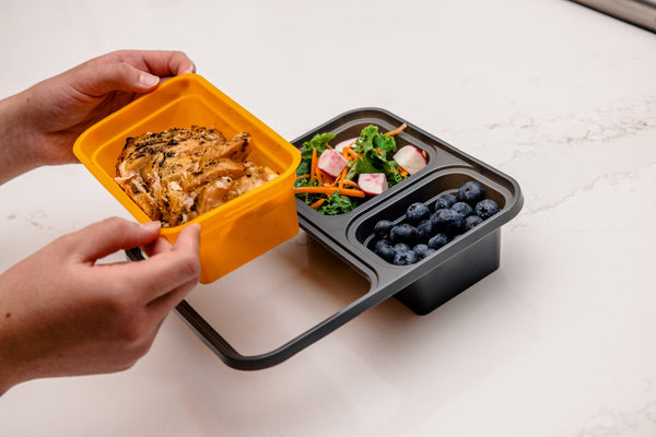 Orange entree section snapped out and separated from the container body
